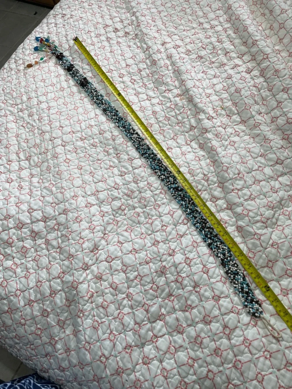 Woven beaded and tassel belt